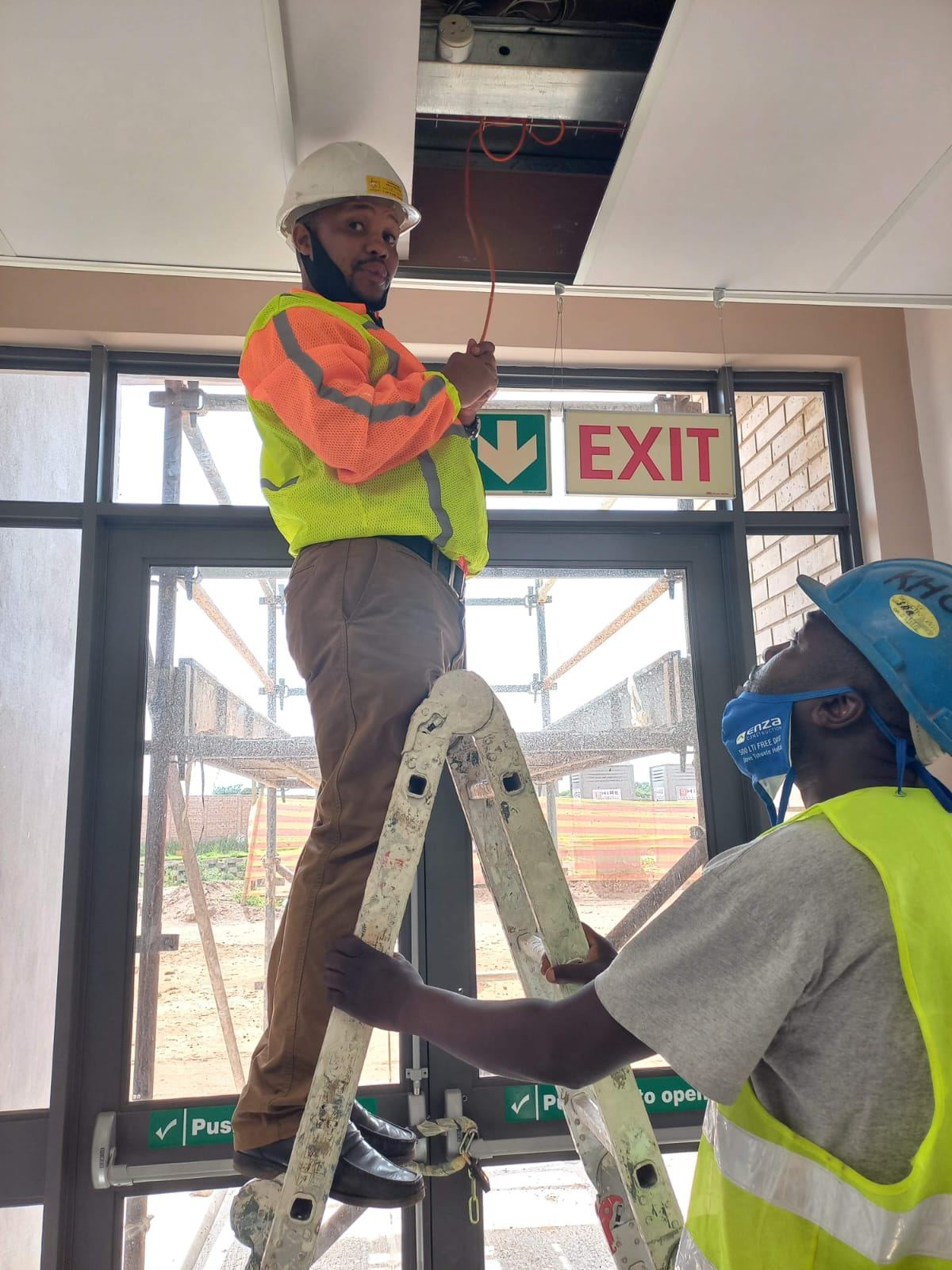 Technicians installing security equipment